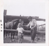 My mom and I visiting my uncle's horse.